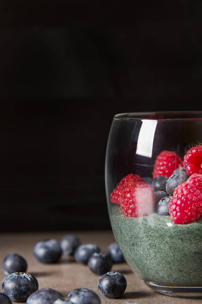 Fresh juicy bluesberries spirulina smoothies in the glass. Simpl