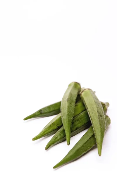 Lady Fingers or Okra. White isolated background. Space for text — Stock Photo, Image