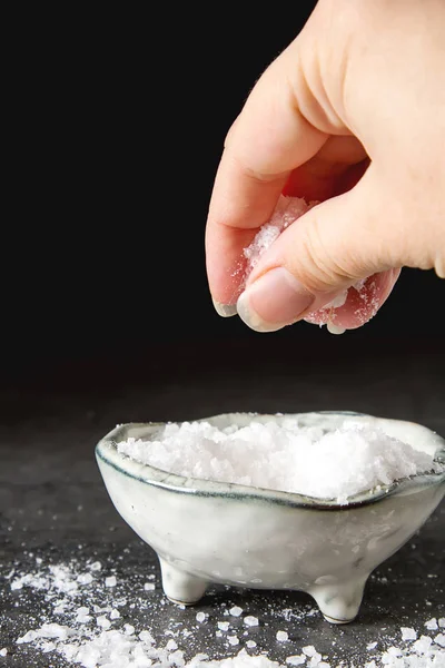 Sea salt. Dark background. Spa treatments. — Stock Photo, Image