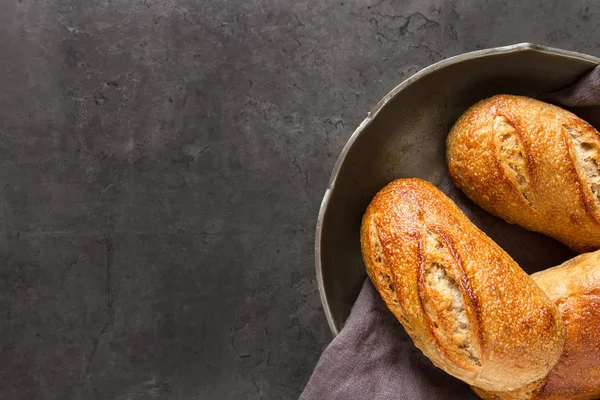 Homemade Italian bread. Fresh bakery. Dark background.