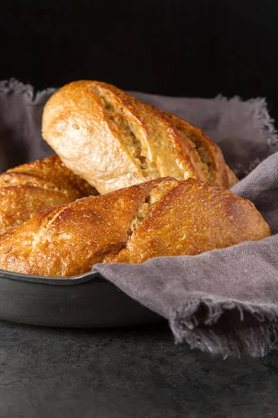 Homemade Italian bread. Fresh bakery. Dark background. — Stock Photo, Image