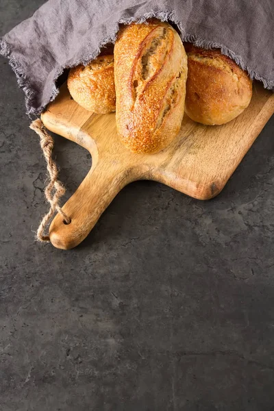 Homemade Italian bread. Fresh bakery. Dark background.