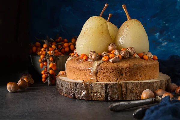 Autumn meal. Pie with pears, sea buckthorn and nuts. Dark backgr — Stock Photo, Image