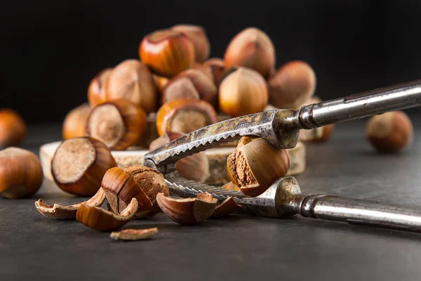 Autumn meal. Hazelnuts are nuts. Dark background. — Stock Photo, Image