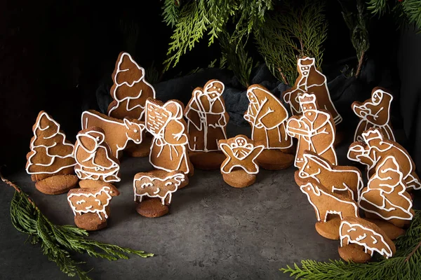 Christmas Betlem decoration, gingerbread. The Birth of Christ. Dark background