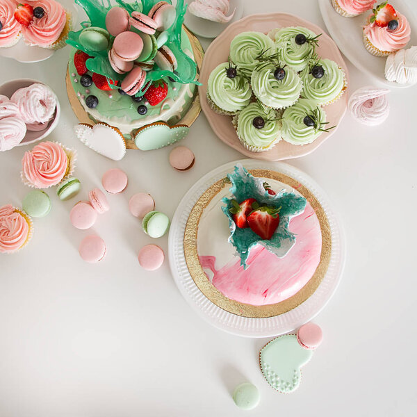 Candy bar with cakes, muffins, meringues, macaroons and biscuits