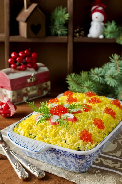 Salad with crab sticks and caviar. The salad on the holiday tabl — Stock Photo, Image