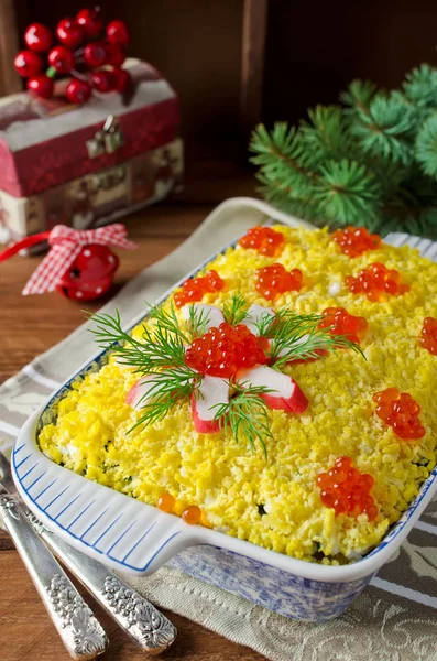 Salad with crab sticks and caviar. The salad on the holiday tabl — Stock Photo, Image