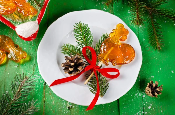Lollipop in shape of rooster on the stick on Christmas backgroun — Stock Photo, Image