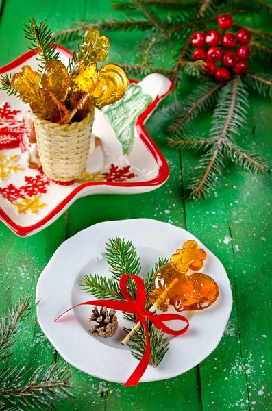 Lollipop in shape of rooster on the stick on Christmas backgroun — Stock Photo, Image