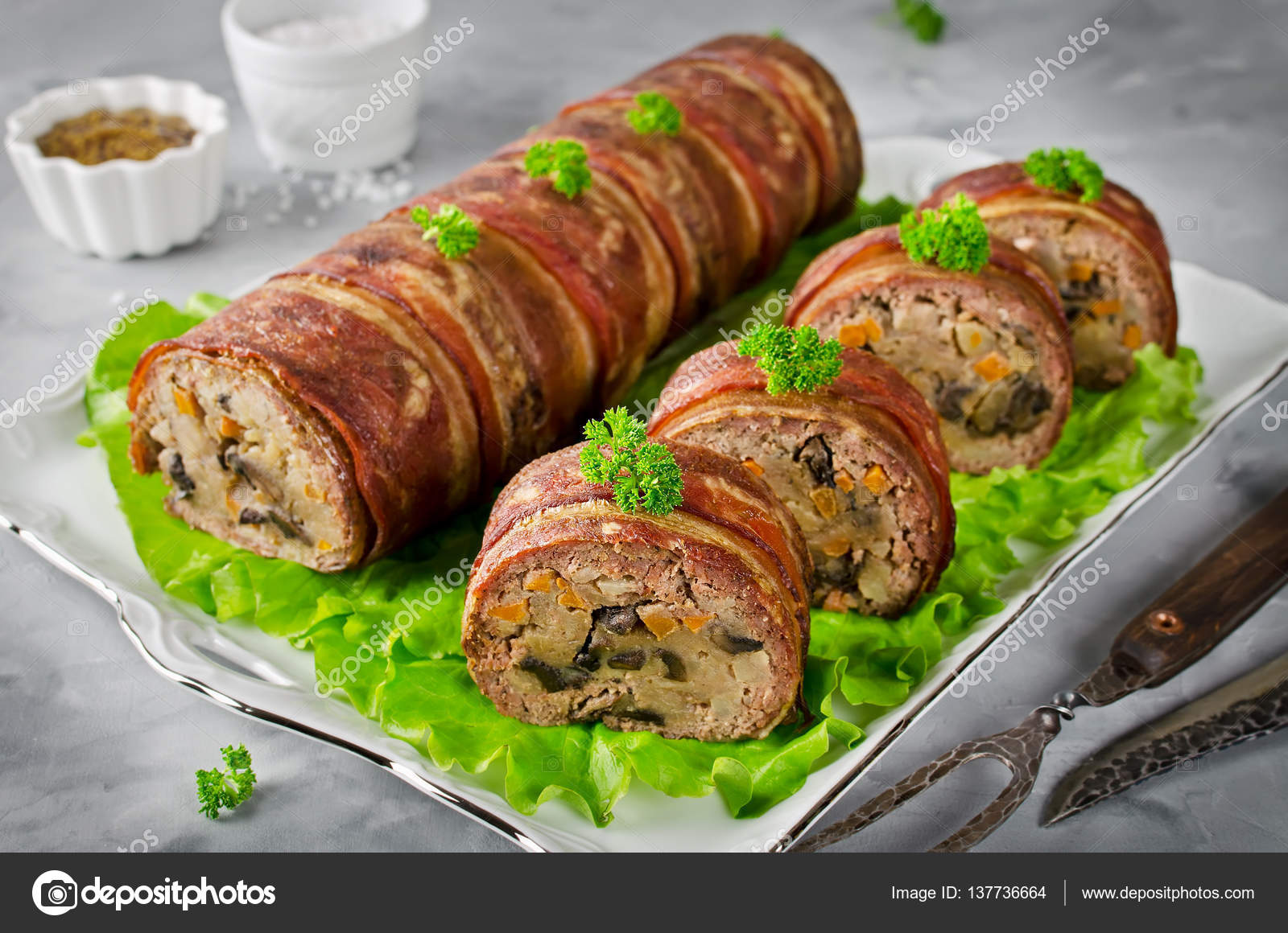 Oven baked meatloaf with bacon on a concrete grey background Stock