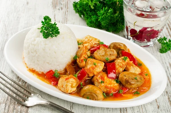 Chicken stew with mushrooms served  with rice — Stock Photo, Image