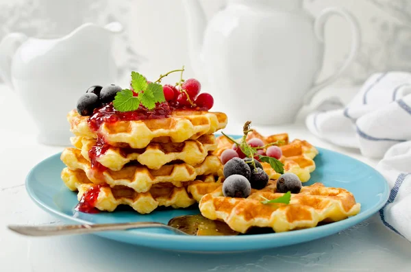 Belgian waffles with berries and raspberry topping — Stock Photo, Image
