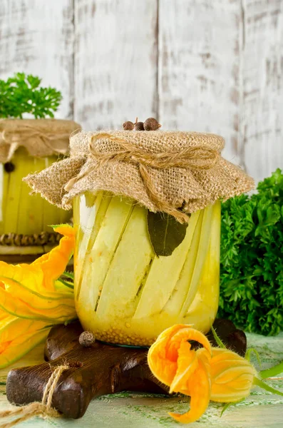 Zucchini preserve in glass jar on a wooden table — Stock Photo, Image