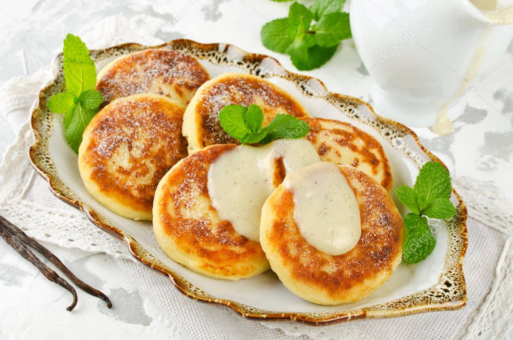 Homemade cottage cheese pancakes with vanilla sauce