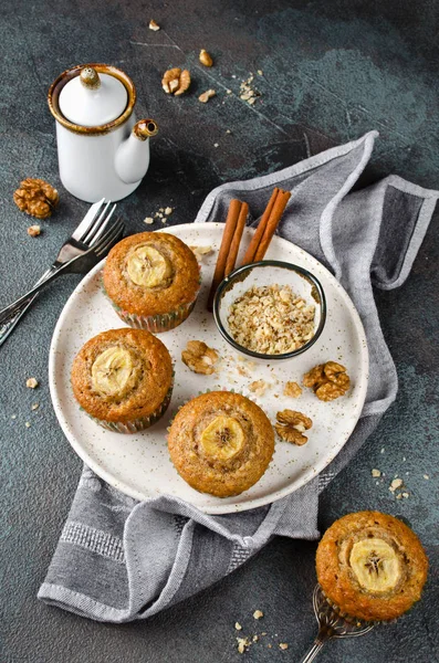 Banana muffins with cinnamon on a concrete background — Stock Photo, Image