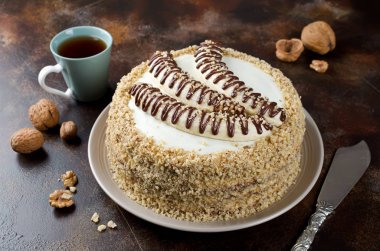 Chocolate cake with bananas decorated with chocolate topping and