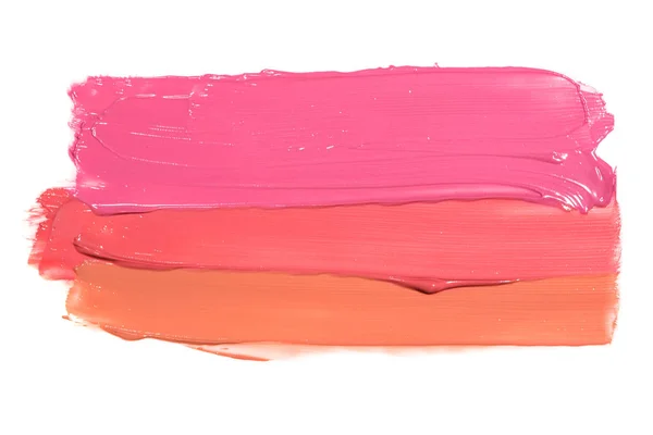 Examples of different shine lip glosses flowing downwards on a white background — Stock Photo, Image