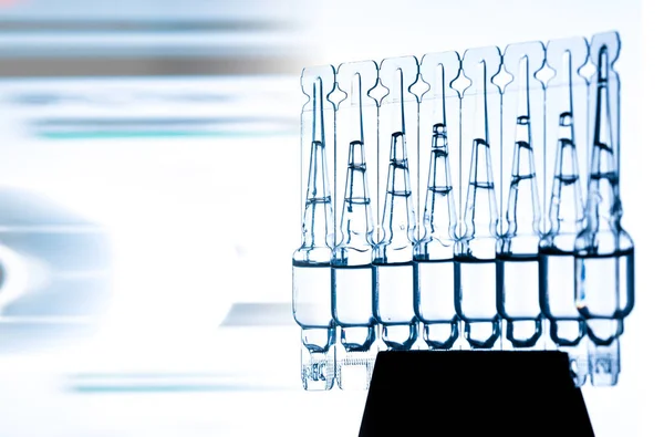 Group of ampoules with a transparent medicine in medical laboratory — Stock Photo, Image