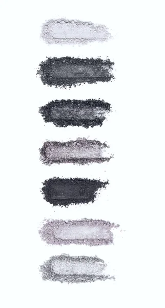 A smashed, gray toned eyeshadow make up palette isolated on a white background — Stock Photo, Image