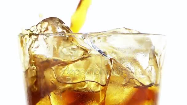 Pouring Cola into a Glass with the Ice Cubes. — Stock Video