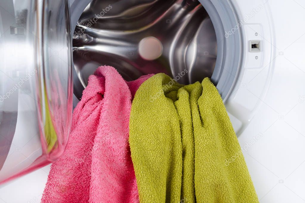 color towels in a open wash machine closeup