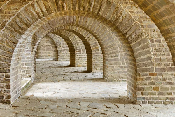 archway with many stone arches, antique tunnel