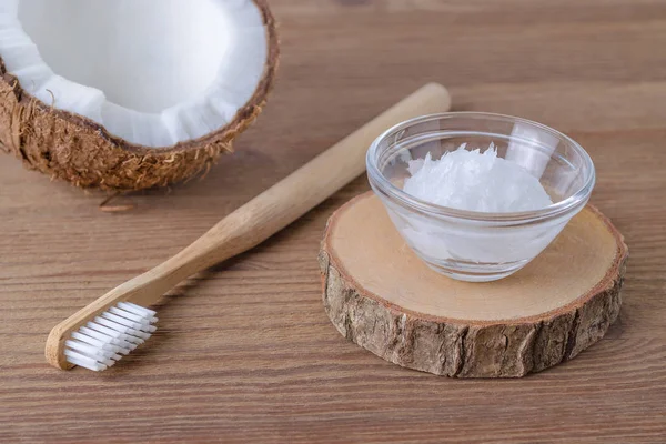 Coconut oil toothpaste, natural alternative for healthy teeth, wooden toothbrush — Stock Photo, Image