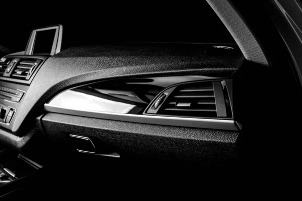 The ideal surface of plastic in the interior of the car is black after polishing and cleaning with car chemistry. Black and white photo