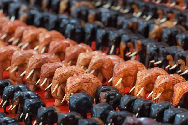 Groups of red and black souvenir elephants. — Stock Photo, Image