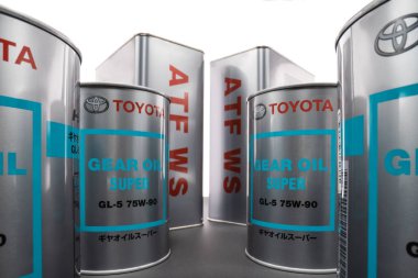 Wide angle view on metal cans with transmission synthetic oil  clipart