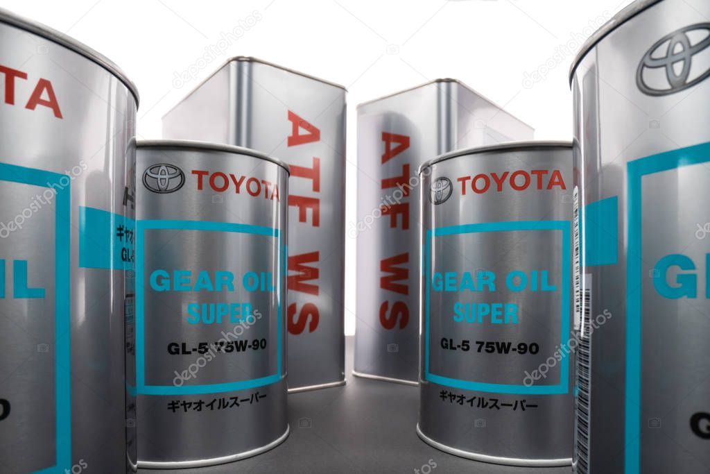 KHARKIV, UKRAINE - DECEMBER 12, 2019: Shooting on wide angle metal cans with transmission synthetic oil Toyota GEAR OIL SUPER 75W-90 GL-5 and ATF WS, for axle, gearbox, differential. Trademark owned by the Toyota Motor Corporation