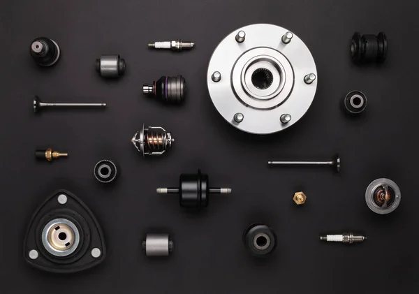 Auto parts: valves, spark plugs, silent blocks, sensors, wheel h — Stock Photo, Image