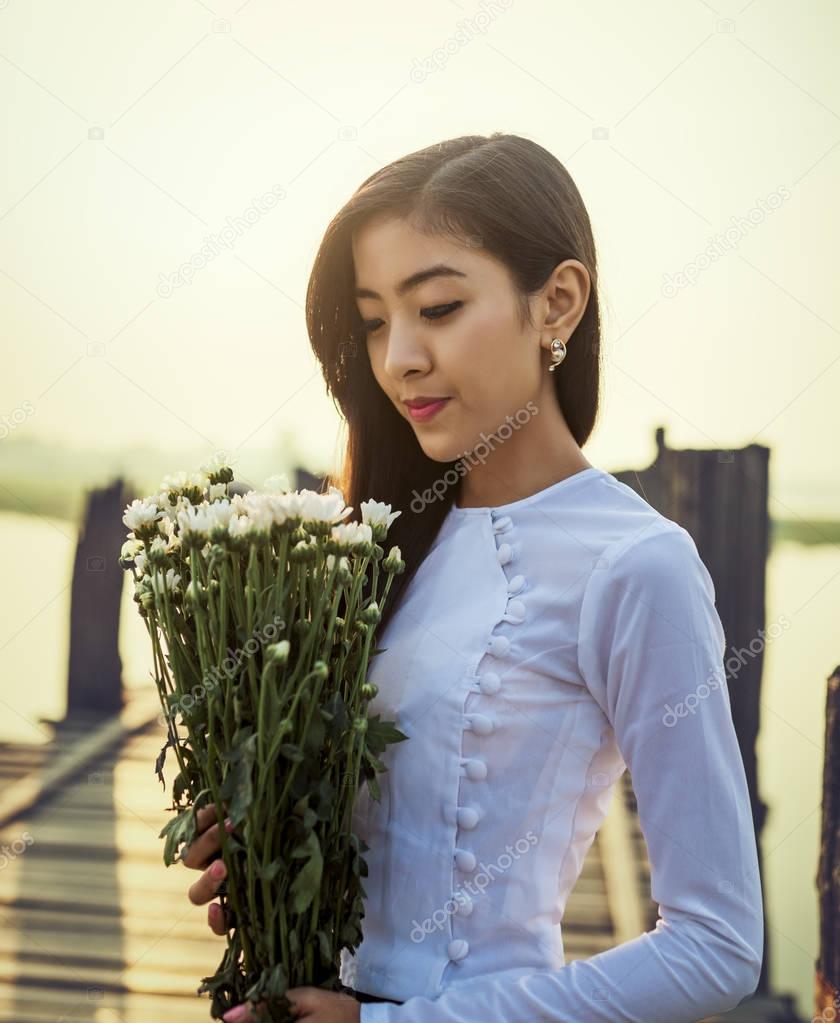 Burmese woman with flower