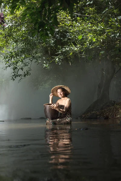 Beautiful woman in traditional dress bathing — Stock Photo, Image