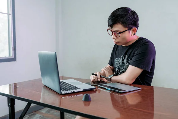 Portrait Asian male him are freelance work from home