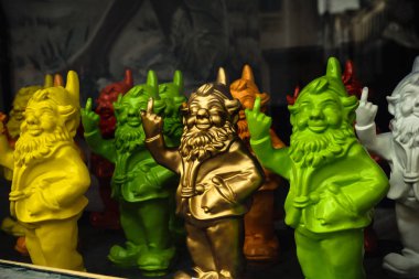 Gnomes showing middle finger in the store window in Bruges, Belgium clipart
