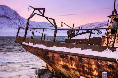 Old rotten fish boat in Teriberka, Murmansk Region, Russia clipart