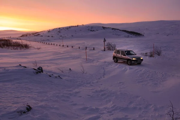 Car on the arctic road in day time. Teriberka, Murmansk Region, Russia