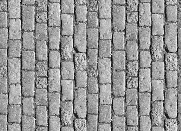 Stone pavement texture. Granite cobblestoned pavement background. Abstract background of old cobblestone pavement close-up. Seamless texture. Perfect tiled on all sides — Stock Photo, Image