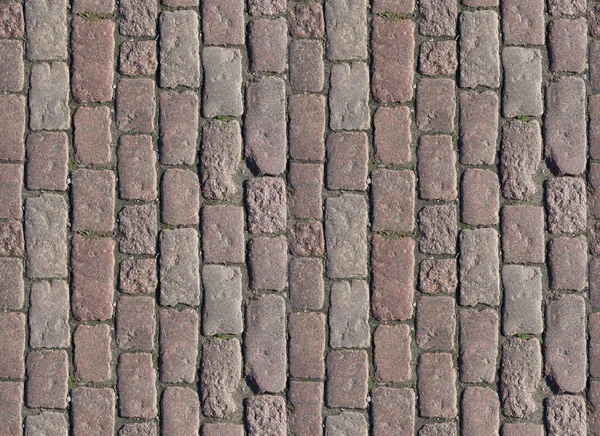 Taş kaldırım dokusu. Granit kaldırım taşlı zemin. Eski kaldırım kaldırımının soyut arkaplanı. Kusursuz bir doku. Her tarafı mükemmel döşenmiş.