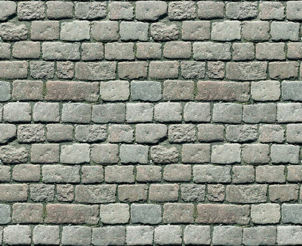 Stenstensbeläggning. Granit kullerstenad trottoar bakgrund. Abstrakt bakgrund av gamla kullersten trottoaren närbild. Sömlös konsistens. Perfekt kaklat på alla sidor — Stockfoto