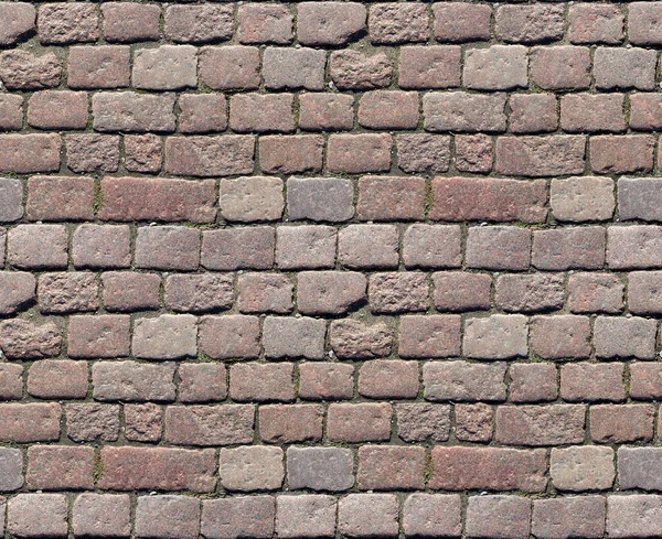 Stenstensbeläggning. Granit kullerstenad trottoar bakgrund. Abstrakt bakgrund av gamla kullersten trottoaren närbild. Sömlös konsistens. Perfekt kaklat på alla sidor — Stockfoto