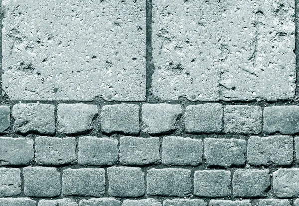 Steinpflaster. Granit gepflastertes Pflaster Hintergrund. Abstrakter Hintergrund des alten Kopfsteinpflasters in Nahaufnahme. Nahtlose Textur. Perfekt gefliest auf allen Seiten — Stockfoto