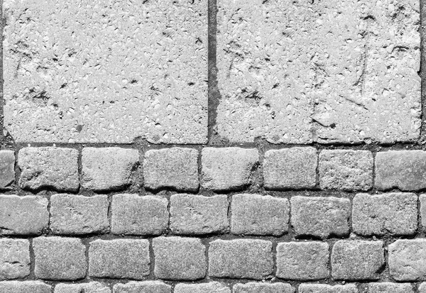 Stone pavement texture. Granite cobblestoned pavement background. Abstract background of old cobblestone pavement close-up. Seamless texture. Perfect tiled on all sides