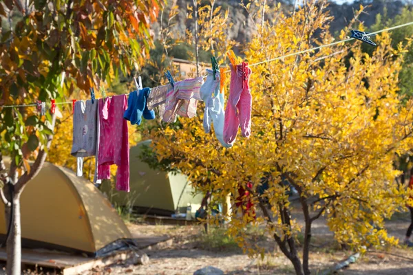 Children Clothing hanging on rope — Stock Photo, Image