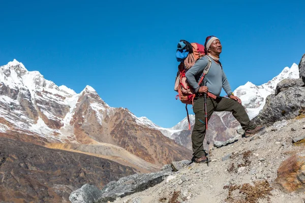 Nepalese Guide staying on Slope — Stock Photo, Image