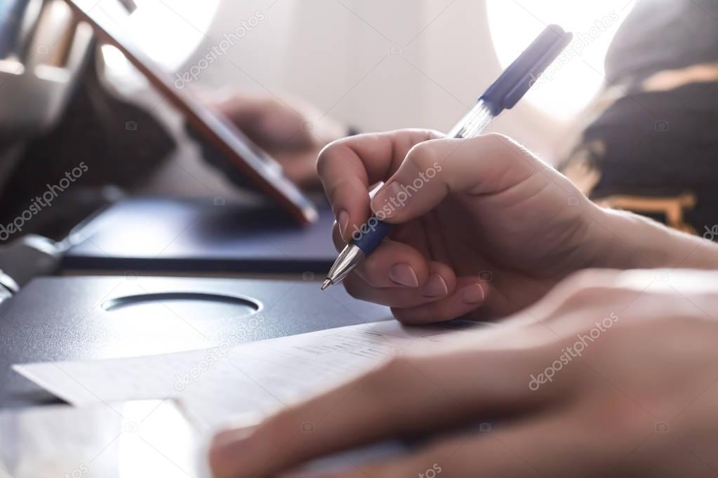 People filling immigration form