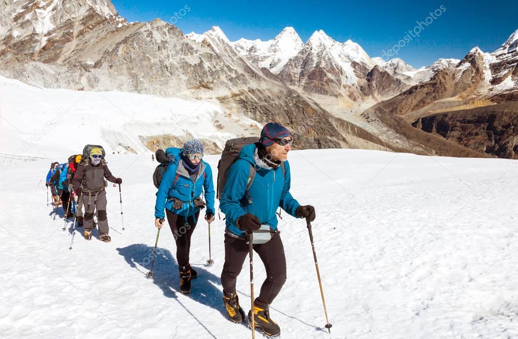 Group of Climbers walking on Glacier