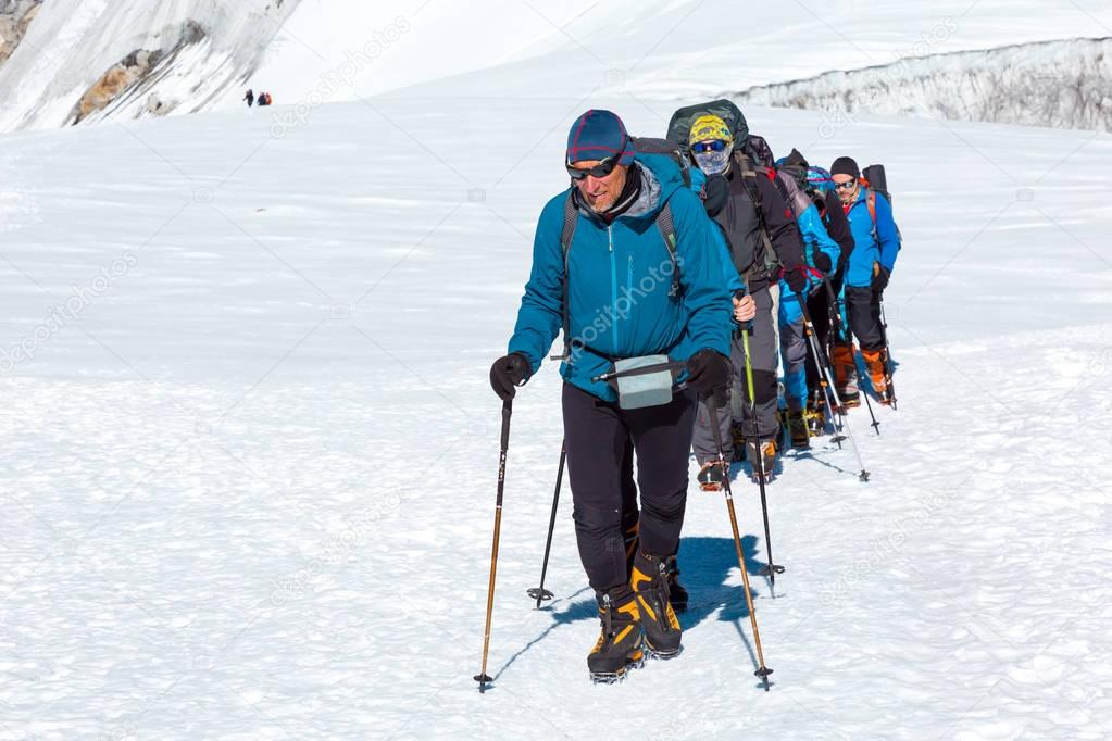 Group of Climbers walking on Glacier